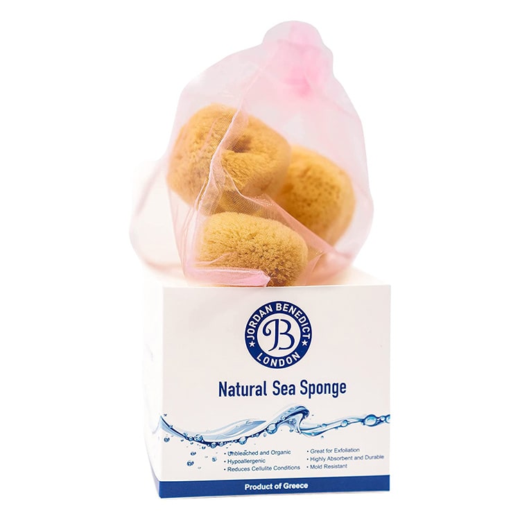 Natural face care sponges in a gift box and pink net